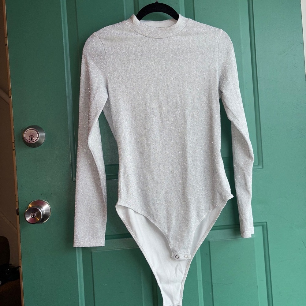 Unbranded large silver shimmer bodysuit one small fabric pull shown